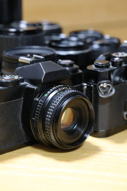 istock Single-lens reflex camera and lenses lined up behind 1349589100