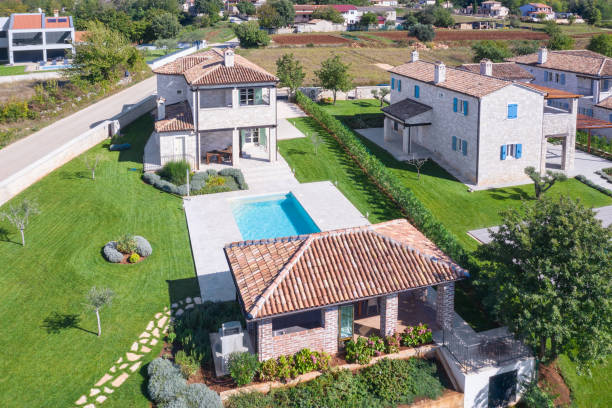 istock Luxurious beautiful modern villas with swimming pools and yard gardens 1349589975