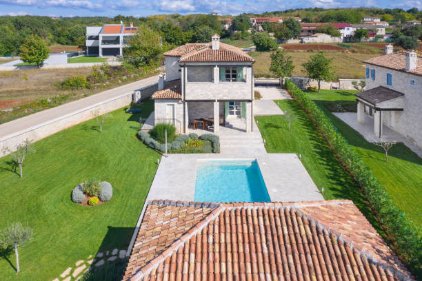 istock Luxurious beautiful modern villas with swimming pools and yard gardens 1349589977