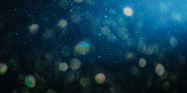 istock a christmas night sky background with blur 1349597591