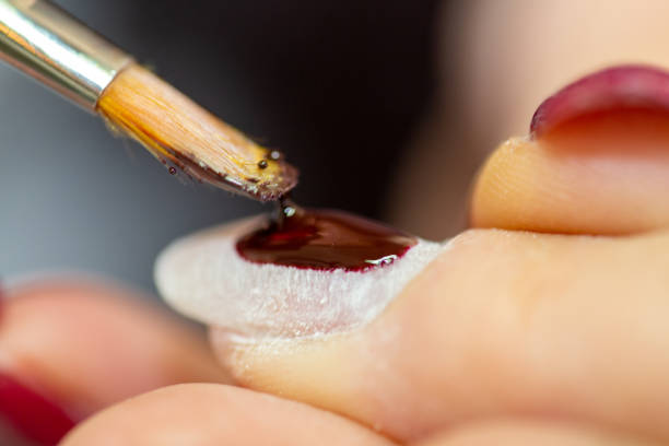 istock Woman receives a manicure, close up 1349598884