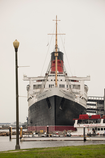 Long Beach, California, USA - September 26, 2021: Morning light shines on the iconic 1936 maritime vessel, the Queen Mary.