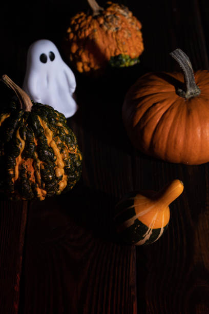istock picture for halloween cute ghost and pumpkins 1349603431