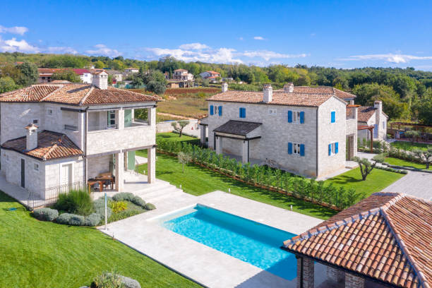 istock Luxurious beautiful modern villas with swimming pools and yard gardens 1349604323