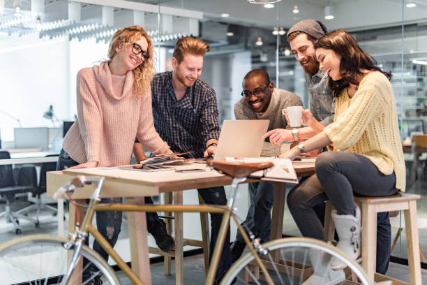 istock Happy freelance workers working on a meeting in the office. 1349606254