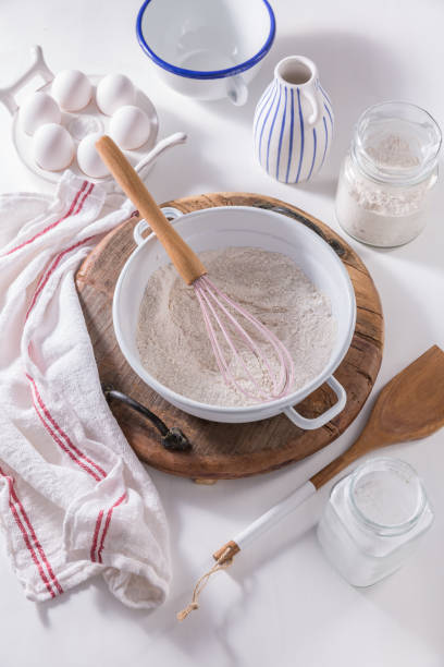 istock Flour and egg with baking ingredients and kitchen utensils 1349607290