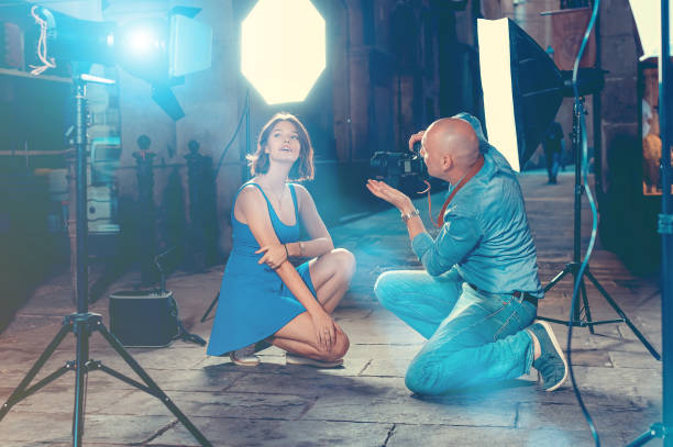 istock Professional photo shooting outdoors. Attractive female model po 1349621662