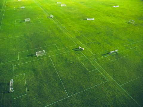 Drone image of green soccer field with goals. Copenhagen.