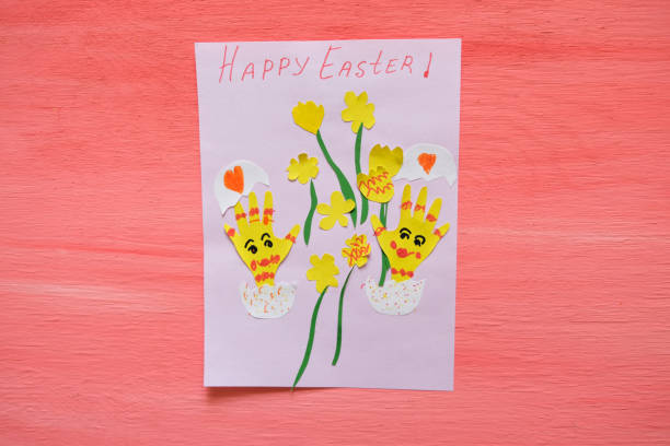 istock Child created card with Easter funny eggs and flowers  from colorful paper. Handmade. Project of children's creativity, handicrafts, crafts for kids. 1349624734