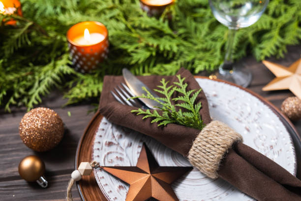 istock Christmas table setting with decorations, fir branches and candles. 1349632938