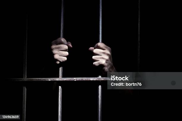 Hands Of The Prisoner Stock Photo - Download Image Now - Prisoner, Prison Cell, Criminal