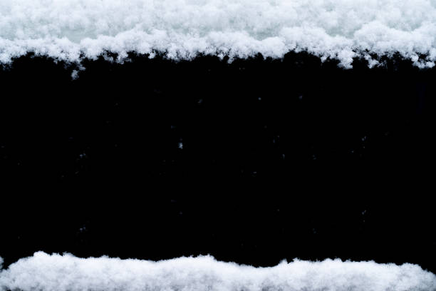 Winter frame made by snow isolated on black background