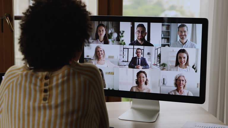 Young black female participate at online training in conference app