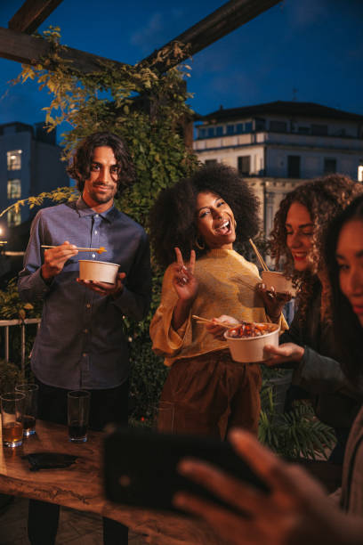istock Friends take a selfie on a rooftop party 1349649949