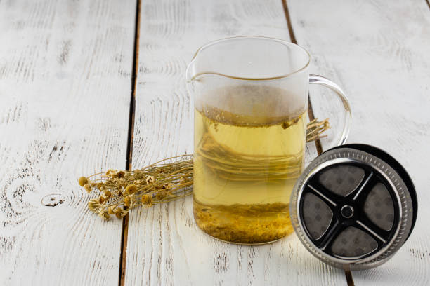 Portion of dried Camomile on an old wooden table