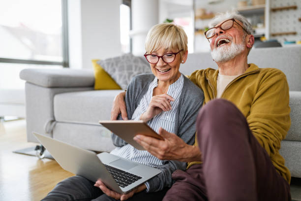 istock Senior couple doing video chat with grandchildren using computer 1349659407