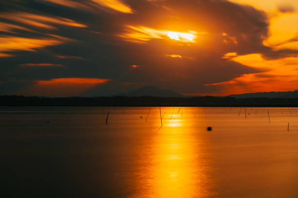 istock Orange colored sunset sky with Mt. Tsukuba and lake Hinuma, OCt. 2021 1349660931