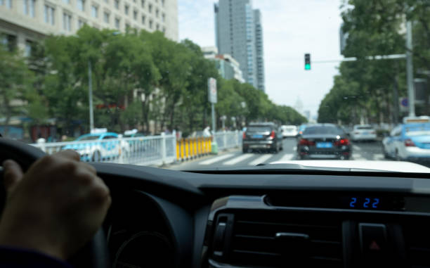istock Driving car in modern city 1349661290