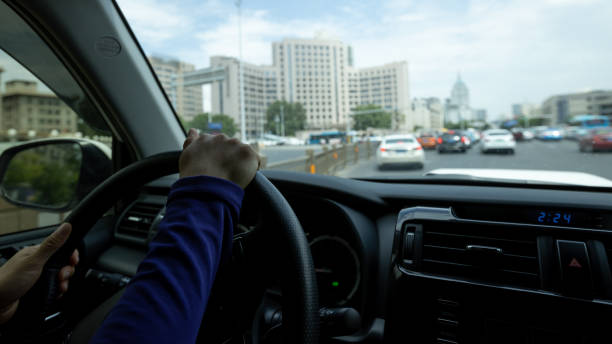 istock Driving car in modern city 1349661332