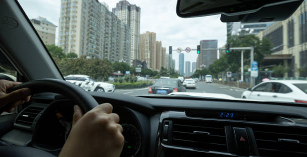 istock Driving car in modern city 1349661575