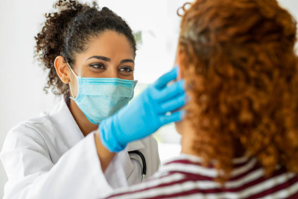 istock Female doctor examining 1349661768