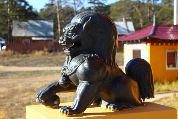istock Buddhist Snow Lion bronze sculpture protecting temple entrance 1349664002