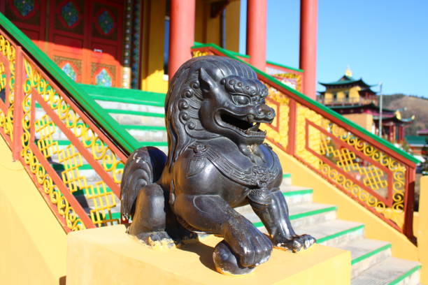 istock Buddhist Snow Lion bronze sculpture protecting temple entrance 1349664104