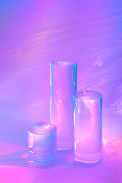 istock three clear glass cylinder podiums on pastel pink background 1349664179