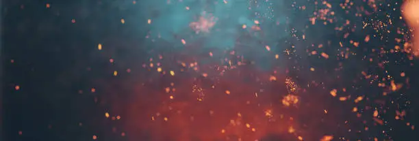 Industrial abstract background with flying fire particles