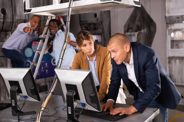 istock People are solving puzzles on computer in escape room stylized laboratory 1349668704