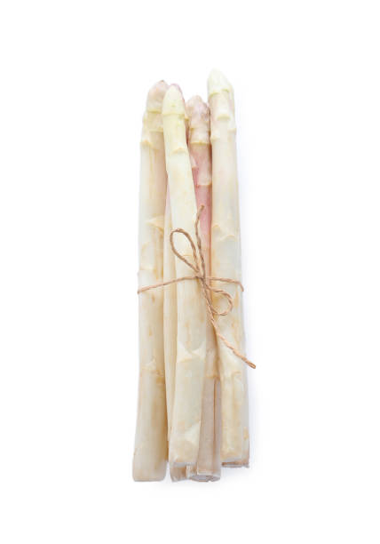 istock Bunch of fresh raw asparagus isolated on white, top view 1349671133