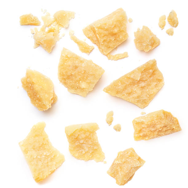 Pieces of parmesan cheese isolated on white background. Pattern. Parmesan  top view. Flat lay. Pieces of parmesan cheese isolated on white background. Pattern. Parmesan  top view. Flat lay. parmesan stock pictures, royalty-free photos & images
