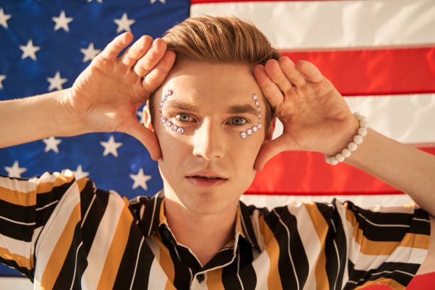 istock Red haired guy with rhinestones at his face staring with sensual gaze 1349675297