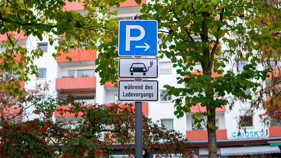 Traffic sign electric car parking and charging station in Germany