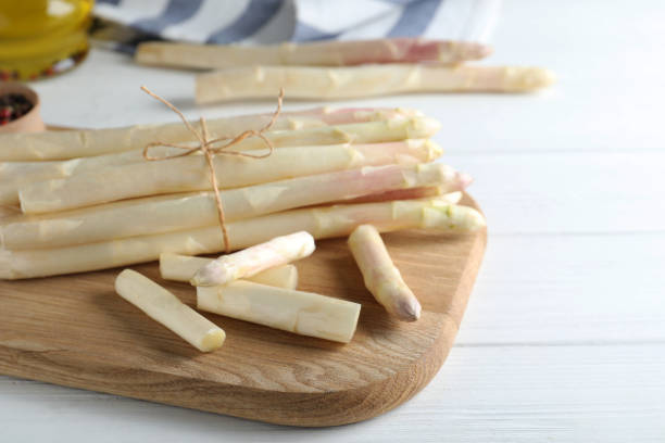 istock Fresh white asparagus on wooden table, closeup 1349678407