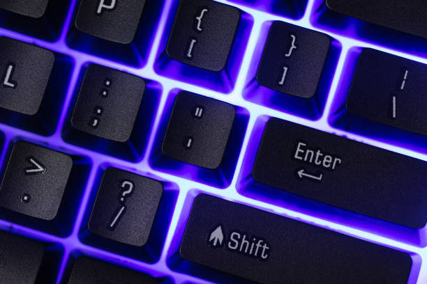 istock Colorful Accessory gaming keyboard with blank space background. Gadget for gamer playing video game online in the neon light darkroom. 1349678655