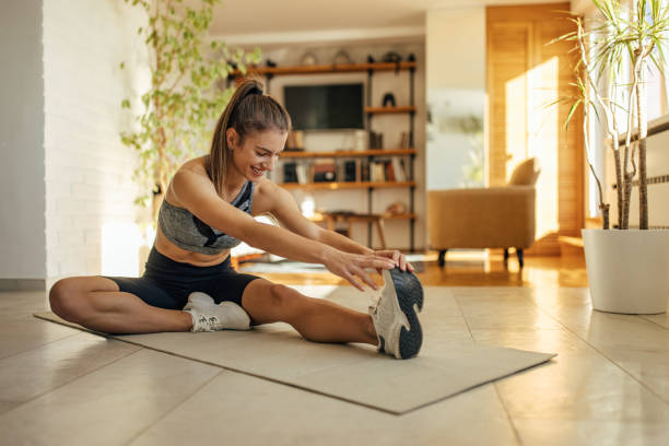 Happy adult woman, stretching her muscles stock photo