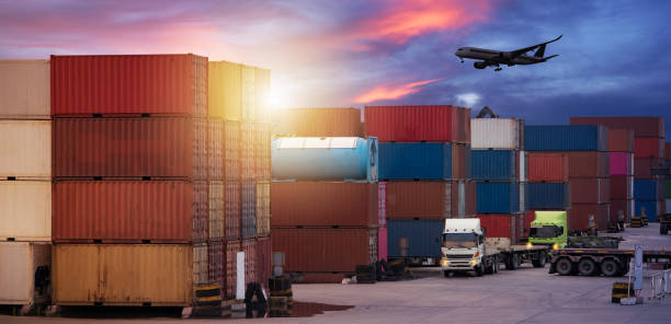 istock Logistics import export background and transport industry of forklift handling container box loading at seaport 1349680845