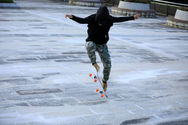 istock Skateboarder skateboarding outdoors in city 1349681128