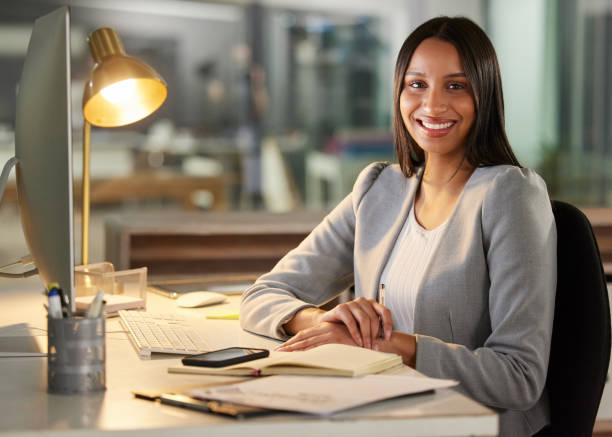 istock Shot of a young businesswoman using a computer in a modern office 1349684802