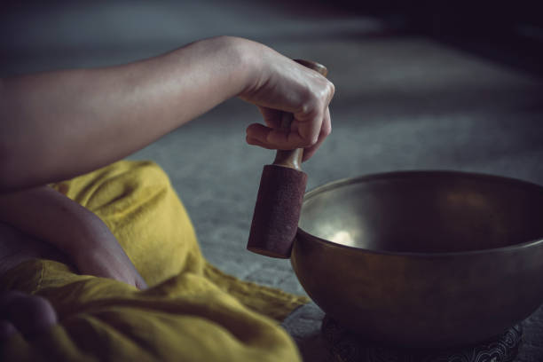 istock Playing with meditation Tibetan sing bowl 1349685491