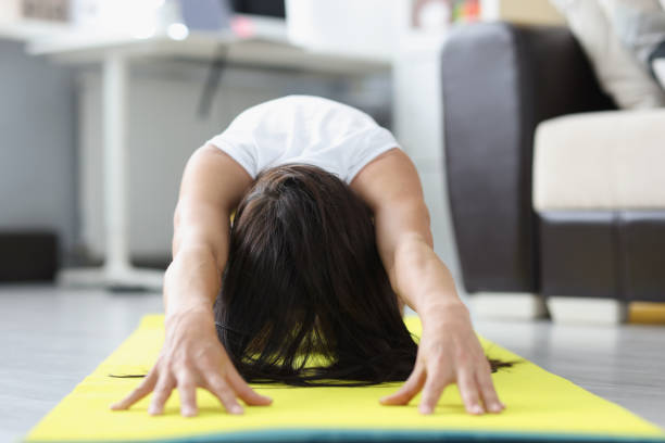 istock Female in sportswear train indoors 1349687497