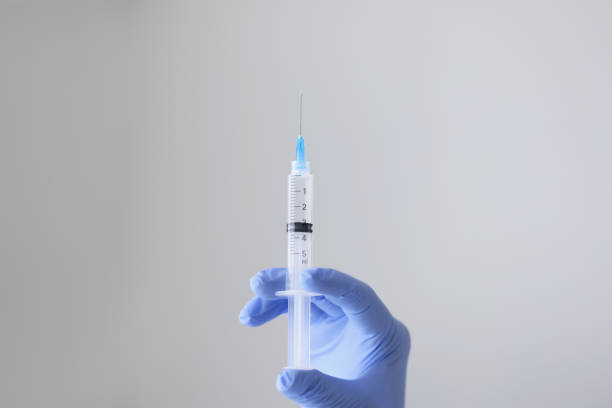 istock Injection syringe with medicine 1349687528
