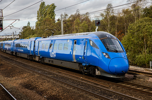 Doncaster, UK - October 27, 2021.  A Hitachi AT 300 Class 308 electric train in blue Lumo livery on its way to London offering cheap and competitive rail fares for passengers and commuters