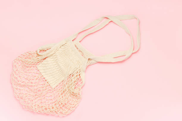 istock Empty mesh shopping bag on pink background top view 1349691106