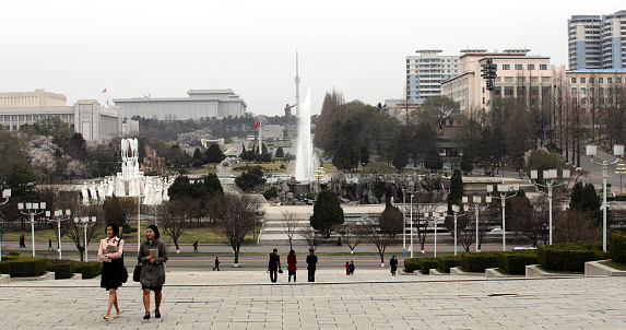 April 13, 2018. Pyongyang, North Korea. \nStudents going to study in the library. North Korea’s central library is located at Kim Il-sung Square in the heart of Pyongyang and can hold up to 30 million books, including a couple of foreign ones. It was built in a traditional Korean style over a period of 21 months and opened in April of 1982 to honor Kim Il-sung’s 70th birthday.