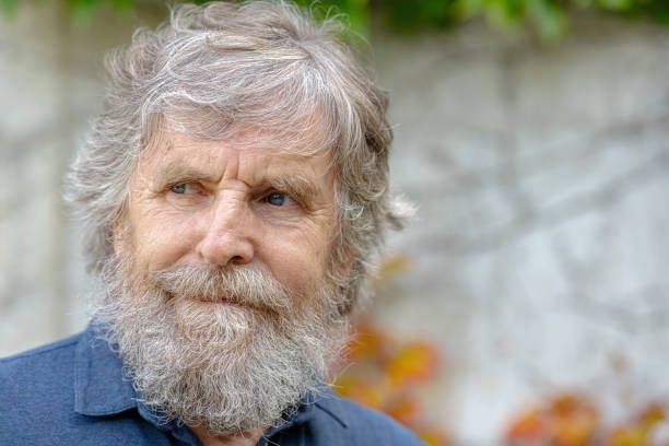 Portrait of a senior man with gray beard a park, Primorska, Slovenia, Europe Portrait of a senior man with gray beard in Primorska Region, Slovenia, Europe,.Nikon D850 primorska white sport nature stock pictures, royalty-free photos & images