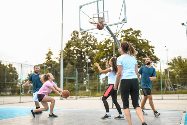istock Basketball Trainees Warming Up By Shooting On Court 1349700333