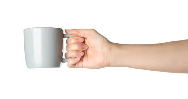 istock Woman holding cup on white background, closeup 1349700567