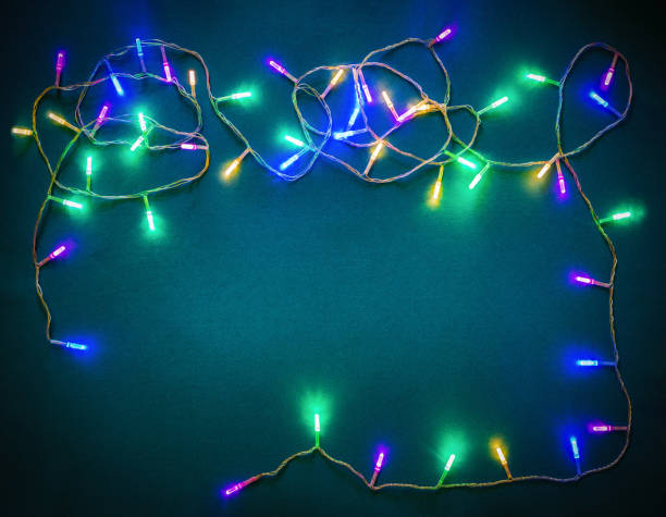 istock Glowing garland over the green background. Flat lay, close-up 1349700736